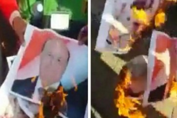 احراق صور الرئيس المستقيل عبد ربه منصور هادي في ساحة خور مكسر
