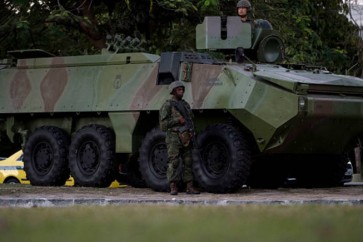 Military troops patrol the area around Santos Dumont airport in Rio de Janeiro, Brazil, on July, 28, 2017.
Brazil has mobilized some 8,500 soldiers to Rio de Janeiro state to fight organized crime and a spike in street violence. Some of these troops have already been deployed with transport trucks seen rolling through the city of Rio these friday afternoon. / AFP PHOTO / Mauro PIMENTEL        (Photo credit should read MAURO PIMENTEL/AFP/Getty Images)