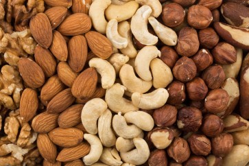 U.S. adults put on about a pound a year on average. But people who had a regular nut-snacking habit put on less weight and had a lower risk of becoming obese over time, a new study finds.