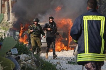 جندي ومستوطن إسرائيلي خلال الاعتداء على بلدة حوارة